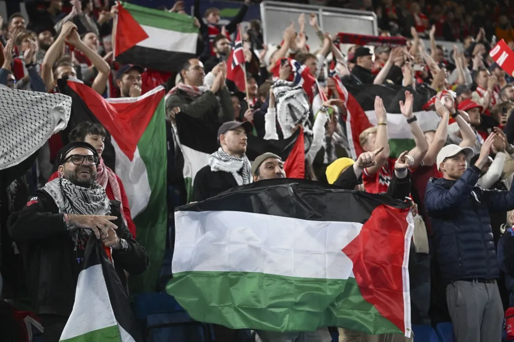 OSLO, NORWAY - OCTOBER 11: Some fans open Palestinian flags and keffiyeh during the Norway v Israel 2026 FIFA World Cup European Qualifier Group I match at Ullevaal Stadium, on October 11, 2025 in Oslo, Norway. Halil Sagirkaya / Anadolu (Photo by HALIL SAGIRKAYA / Anadolu via AFP)