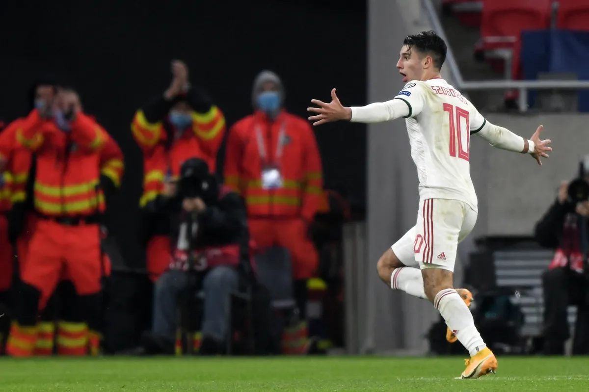 Hungary's midfielder Dominik Szoboszlai celebrates after scoring the team's second goal during the UEFA European Qualifiers play-off final football match between Hungary and Iceland at the Puskas Arena in Budapest on November 12, 2020. Hungary won the match 2-1 and qualify for the Euro 2020. (Photo by Attila KISBENEDEK / AFP)