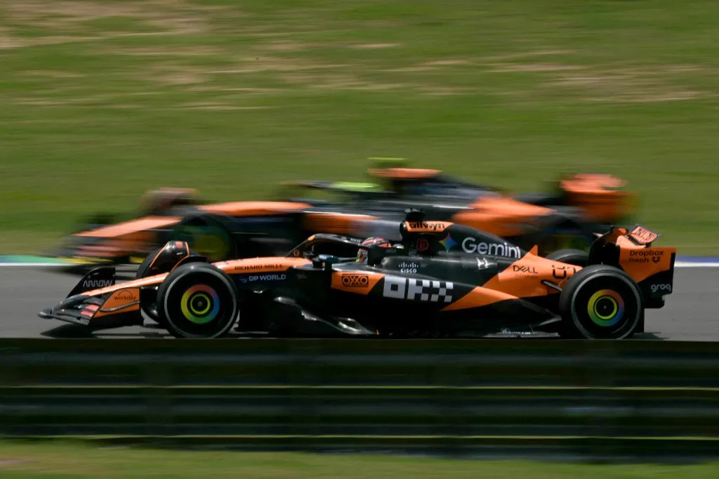 McLaren's Australian driver Oscar Piastri drives next to his teammate British driver Lando Norris during the practice session of the Sao Paulo Formula One Grand Prix at the Jose Carlos Pace racetrack, aka Interlagos, in Sao Paulo, Brazil on November 7, 2025. (Photo by Nelson ALMEIDA / AFP)