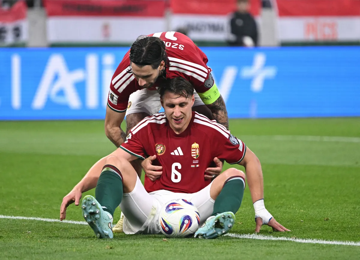 Hungary's midfielder #10 Dominik Szoboszlai (Top) and Hungary's defender #06 Willi Orban react during the FIFA World Cup 2026 Group F European qualification football match betweem Hungary and Republic of Ireland at the Puskas Arena in Budapest, Hungary on November 16, 2025. (Photo by Attila KISBENEDEK / AFP)
