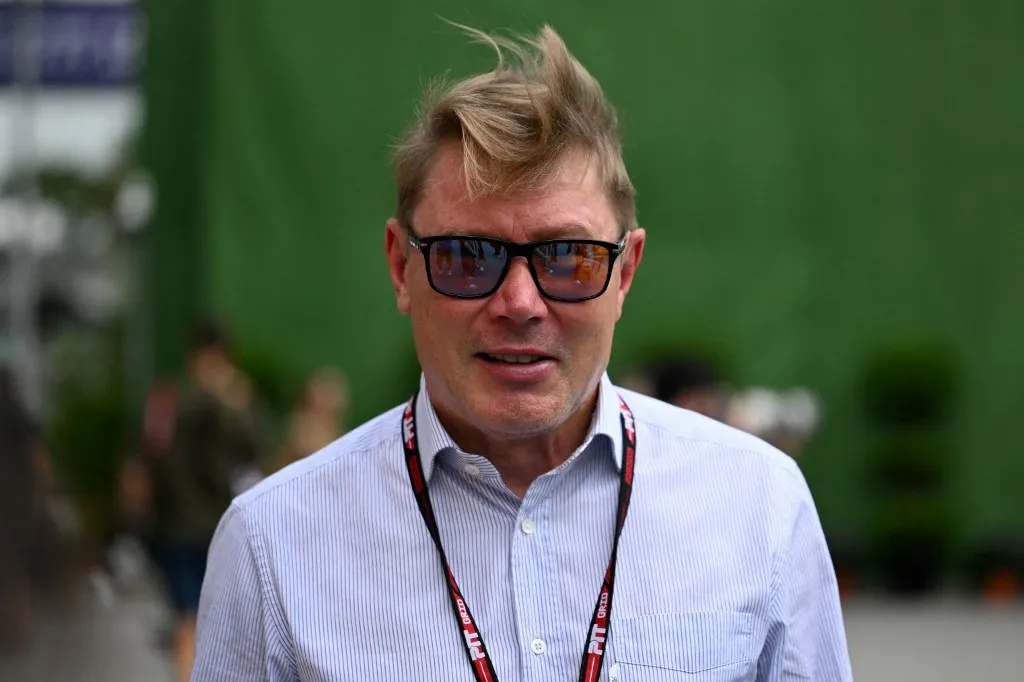 Retired Finnish Formula One driver Mika Hakkinen looks on before the first practice session ahead of the Formula One Singapore Grand Prix night race at the Marina Bay Street Circuit in Singapore on October 3, 2025. (Photo by MOHD RASFAN / AFP)