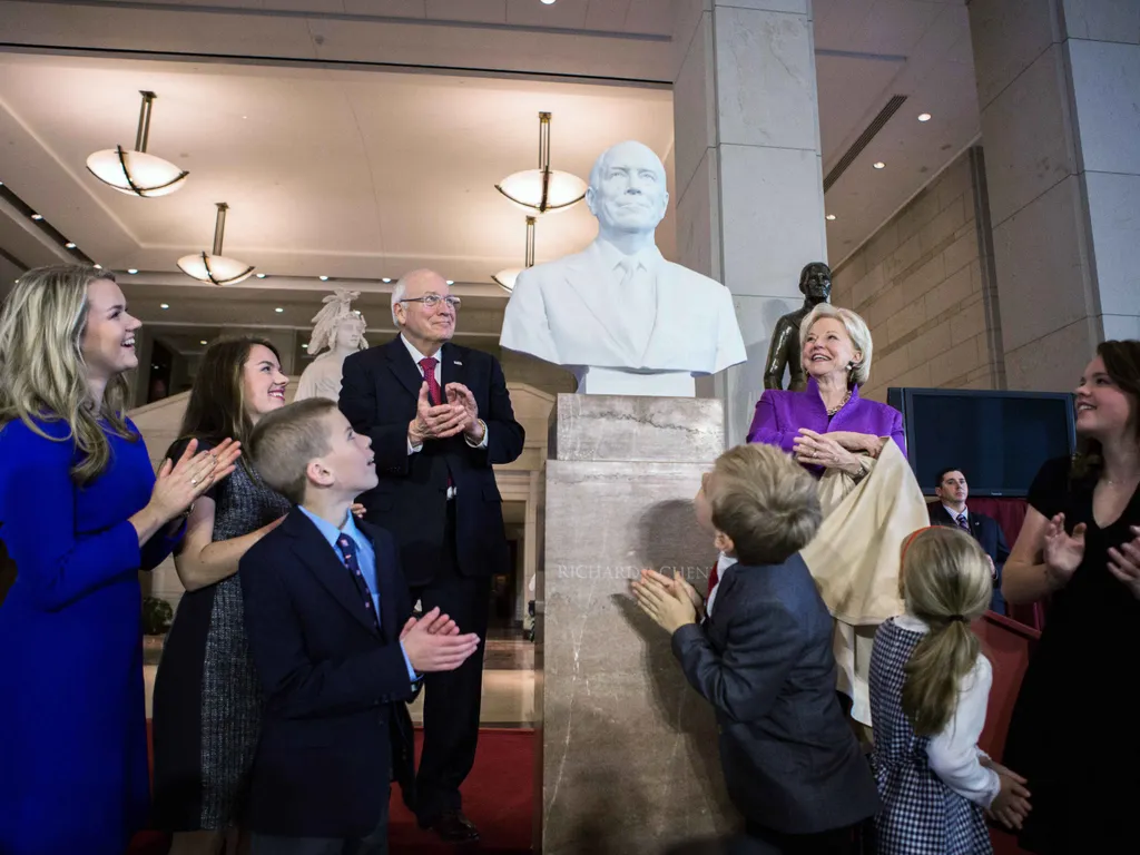 WASHINGTON, DC - DECEMBER 3: Former Vice President Dick Cheney (4th L), along with his wife, Lynne Cheney (4th R) and their grandchildren look at the bust of the former Vice President after it was unveiled at Emancipation Hall inside the U.S. Capitol Dece