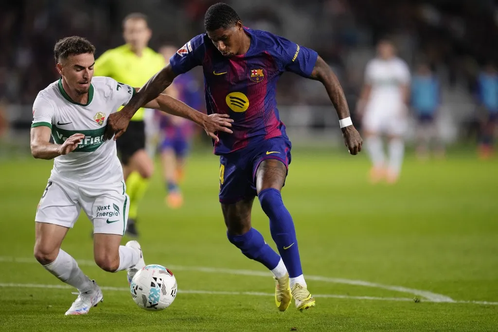Marcus Rashford left winger of Barcelona and England and Adria Pedrosa left-back of Elche and Spain compete for the ball during the La Liga EA Sports match between FC Barcelona and Elche CF at Estadi Olimpic Lluis Companys on November 2, 2025 in Barcelona, Spain. (Photo by Jose Breton/Pics Action/NurPhoto) (Photo by Jose Breton / NurPhoto via AFP)