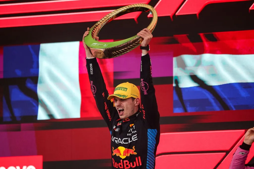 Max Verstappen of Red Bull Racing RB20 celebrates his victory on the podium during the Formula 1 Grand Prix of Brazil at Autodromo Jose Carlos Pace in Sao Paulo, Brazil, on October 31, 2024. (Photo by Gongora/NurPhoto) (Photo by Gongora / NurPhoto via AFP)