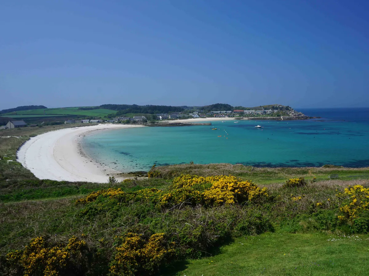 A sandy beach and clear sea water at the holiday island of Tresco, Isles of Scilly