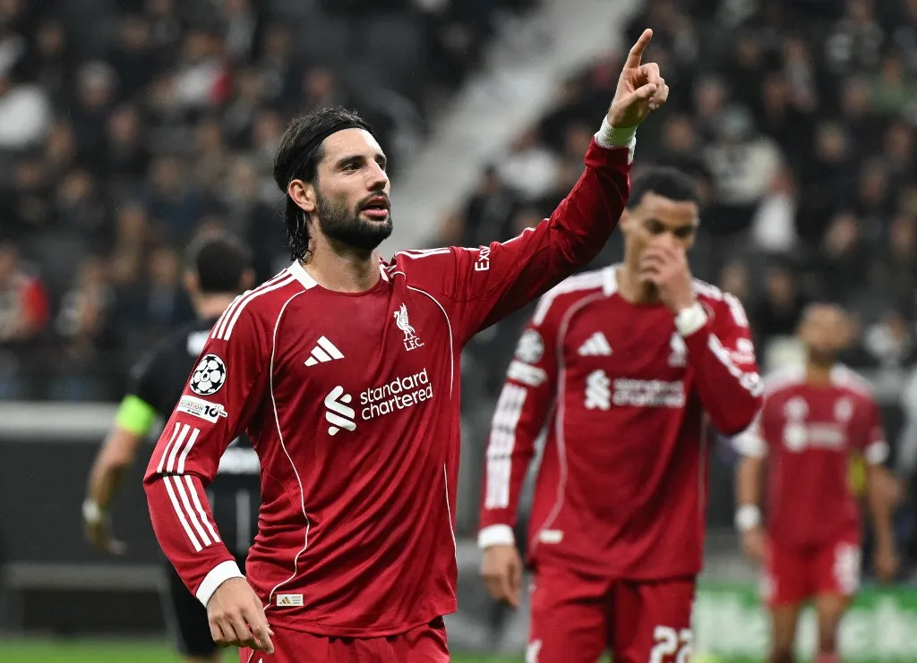 22 October 2025, Hesse, Frankfurt/Main: Soccer: Champions League, Eintracht Frankfurt - Liverpool FC, preliminary round, matchday 3, Deutsche Bank Park. Dominik Szoboszlai (Liverpool FC, l) celebrates next to Hugo Ekitiké (Liverpool FC) after his goal to make it 5:1. Photo: Arne Dedert/dpa (Photo by ARNE DEDERT / dpa Picture-Alliance via AFP)