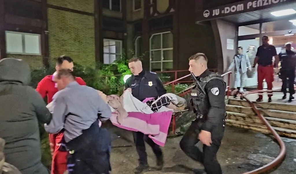TUZLA, BOSNIA AND HERZEGOVINA - NOVEMBER 04: Firefighters deployed to the scene after fire that broke out in a nursing home in Tuzla, Bosnia and Herzegovina on November 04, 2025. The claimed lives according to the local sources. Ahmet Besic / Anadolu (Photo by Ahmet Besic / Anadolu via AFP)