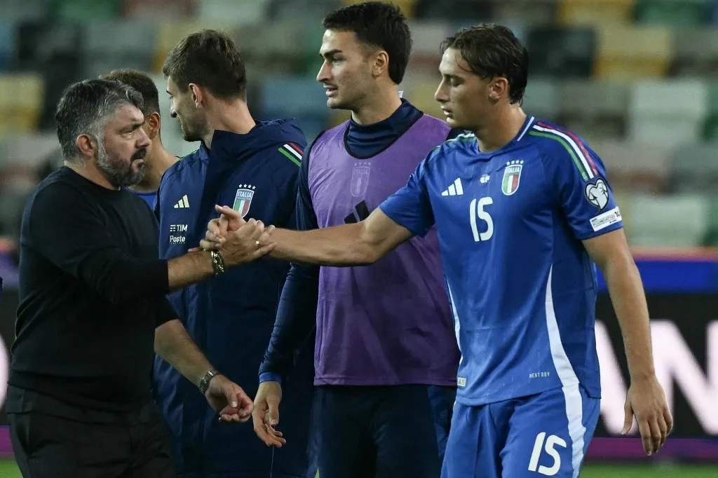 Italy's head coach Gennaro Gattuso (L) congratulates with Italy's forward #15 Pio Esposito after the FIFA World Cup 2026 Group I qualification football match between Italy and Israel, at the the Bluenergy Stadium in Udine northeastern Italy, on October 14, 2025. (Photo by Stefano RELLANDINI / AFP)