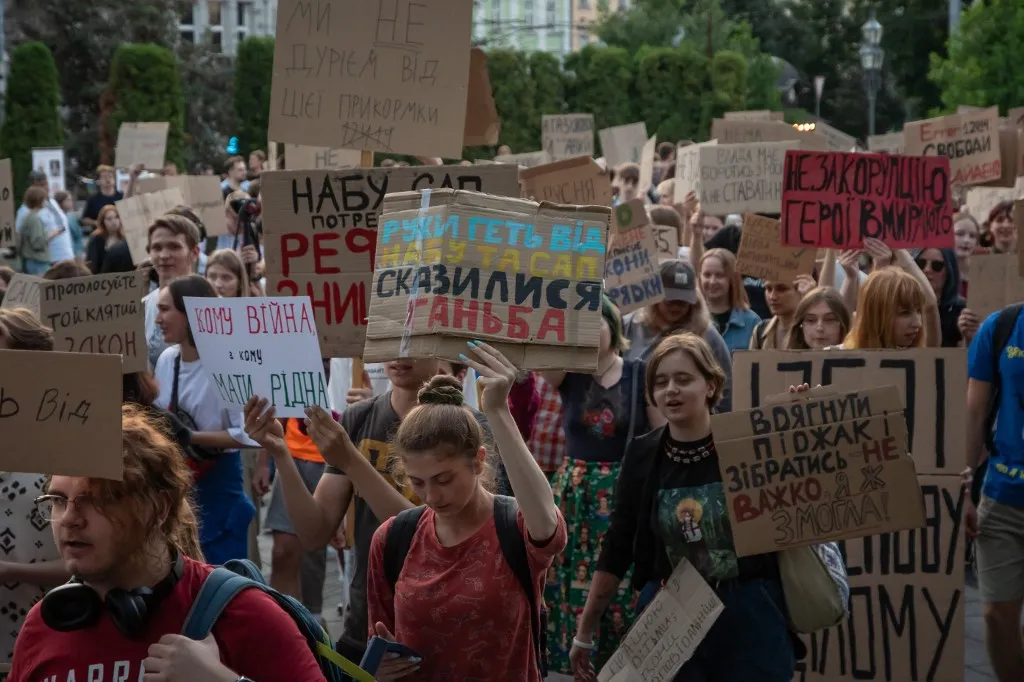 LVIV, UKRAINE - JULY 30: Protesters gather to oppose Bill No. 12414, which reduces the independence of the National Anti-Corruption Bureau of Ukraine (NABU) and the Specialized Anti-Corruption Prosecutor’s Office (SAPO) in Lviv, Ukraine, on July 30, 2025. Demonstrators, many holding placards and draped in Ukrainian flags, called on authorities to uphold anti-corruption safeguards ahead of a new parliamentary vote on Bill No. 13533, scheduled for July 31. The protest comes after President Volodymyr Zelensky signed Bill No. 12414 into law on July 23, despite widespread public and EU criticism. Olena Znak / Anadolu (Photo by Olena Znak / Anadolu via AFP)