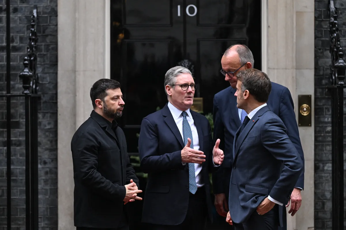 Ukraine's President Volodymyr Zelensky (L), Britain's Prime Minister Keir Starmer (2nd L), French President Emmanuel Macron (front R) and Germany's Chancellor Friedrich Merz (back R) chat outside Number 10 Downing Street following their talks in central London on December 8, 2025. (Photo by Chris J Ratcliffe / AFP)