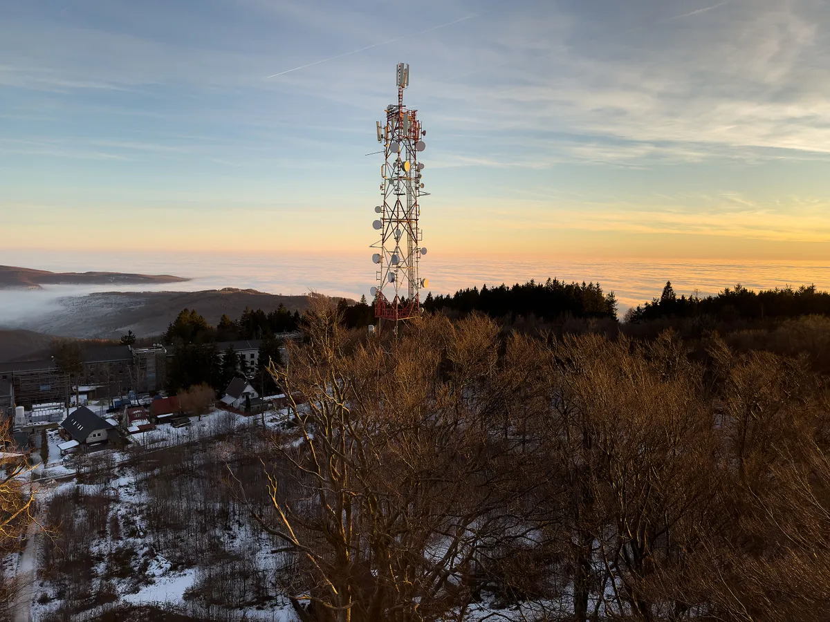 Telecommunications Tower in a Snowy Mountain Landscape at Sunset. Mátraszentimre, Galyatető, 3234 Hungary
