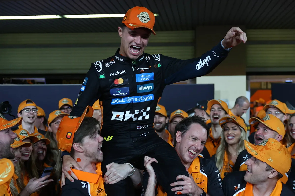 Lando Norris of McLaren celebrates his World Championship after the Formula 1 Abu Dhabi Grand Prix at Yas Marina Circuit in Abu Dhabi, United Arab Emirates on December 7, 2025. (Photo by Jakub Porzycki/NurPhoto) (Photo by Jakub Porzycki / NurPhoto via AFP)