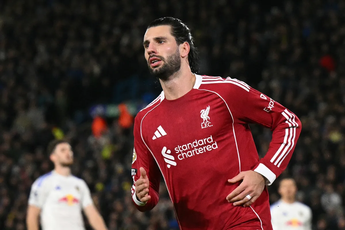 Liverpool's Hungarian midfielder #08 Dominik Szoboszlai celebrates after scoring their third goal during the English Premier League football match between Leeds United and Liverpool at Elland Road in Leeds, northern England on December 6, 2025. (Photo by Oli SCARFF / AFP) / RESTRICTED TO EDITORIAL USE. No use with unauthorized audio, video, data, fixture lists, club/league logos or 'live' services. Online in-match use limited to 120 images. An additional 40 images may be used in extra time. No video emulation. Social media in-match use limited to 120 images. An additional 40 images may be used in extra time. No use in betting publications, games or single club/league/player publications. / 