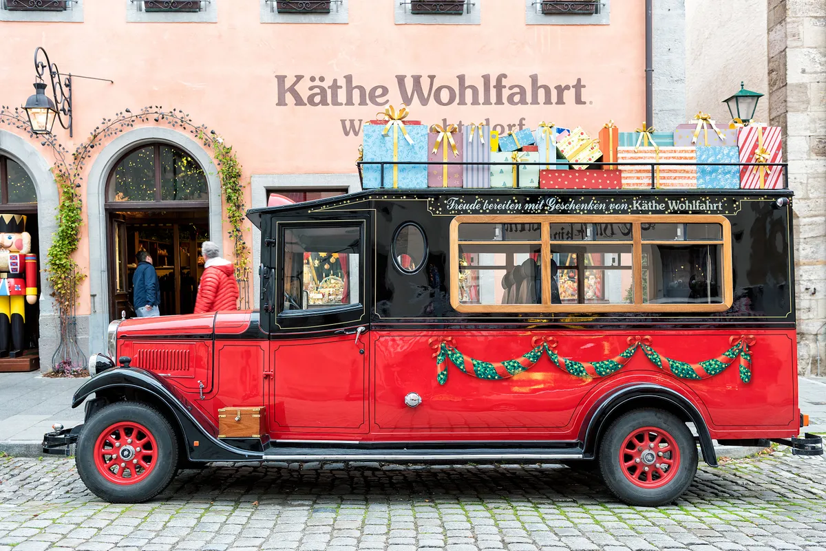 ROTHENBURG, GERMANY - OCTOBER 24, 2017: The famous Christmas store with its museum is open all year long and attracts tourists with a red oldtimer bus