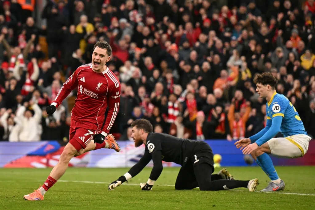 Liverpool's German midfielder #07 Florian Wirtz celebrates after scoring their second goal during the English Premier League football match between Liverpool and Wolverhampton Wanderers at Anfield in Liverpool, north west England on December 27, 2025. (Photo by Oli SCARFF / AFP) / RESTRICTED TO EDITORIAL USE. No use with unauthorized audio, video, data, fixture lists, club/league logos or 'live' services. Online in-match use limited to 120 images. An additional 40 images may be used in extra time. No video emulation. Social media in-match use limited to 120 images. An additional 40 images may be used in extra time. No use in betting publications, games or single club/league/player publications. / 