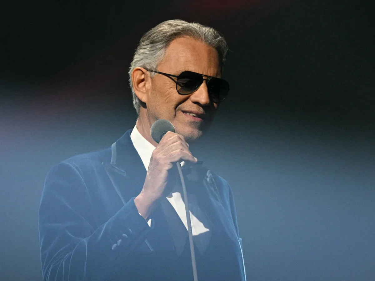 Italian Tenor Classical musician Andrea Bocelli performs on stage during the draw for the 2026 FIFA Football World Cup taking place in the US, Canada and Mexico, at the Kennedy Center, in Washington, DC, on December 5, 2025. (Photo by Jim WATSON / AFP)