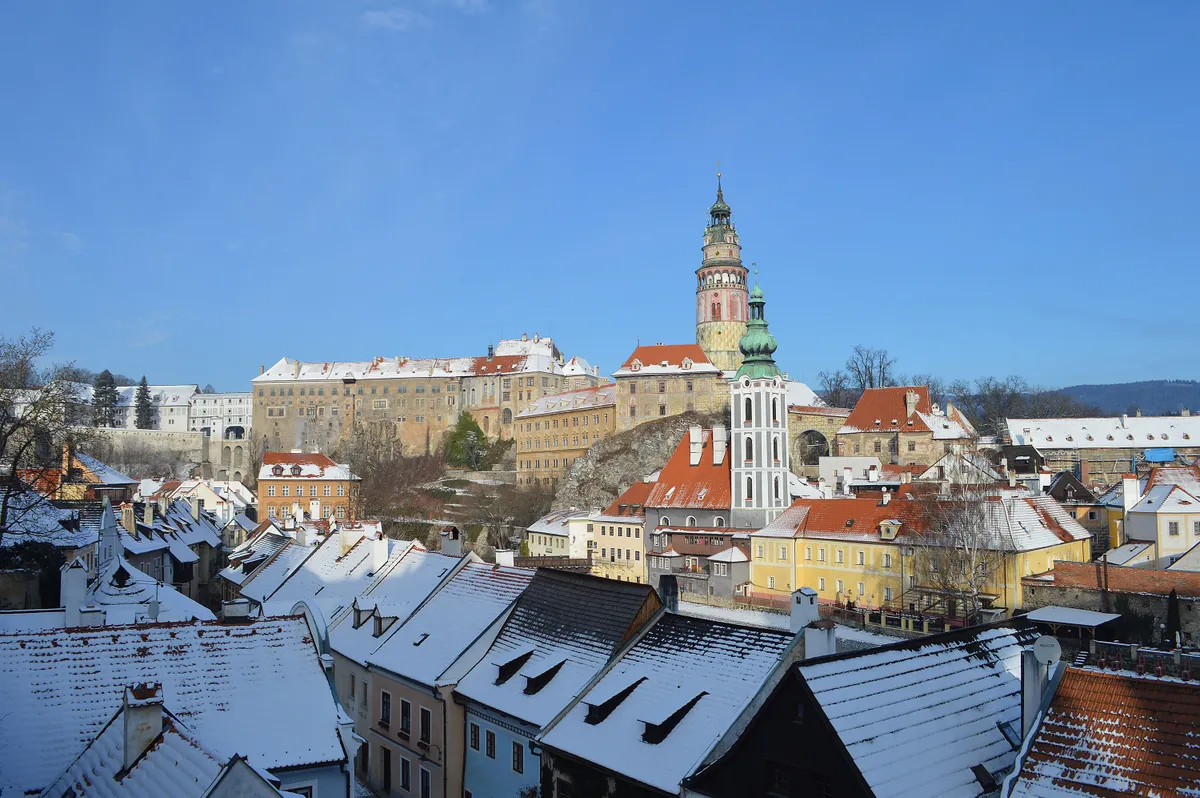Cesky Krumlov, Czechia - Circa January 2019: View of the beautiful little town of Český Krumlov in winter just after it has snowed and covered all the roofs
