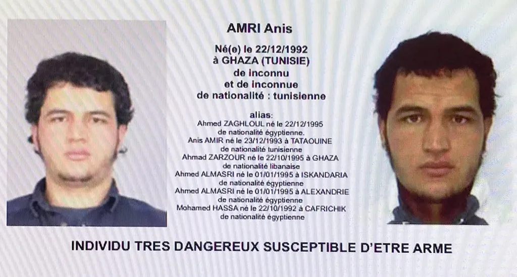 This handout computer screen grab shows a copy of the arrest warrant over a Tunisian man identified as Anis Amri, suspected of being involved in the Berlin Christmas market attack, that killed 12 people on December 19, 2016. German police on December 21, 2016 launched a manhunt and requested an European arrest warrant for Anis Amri, a rejected asylum seeker suspected of involvement in a deadly truck assault on a Berlin Christmas market claimed by the Islamic State jihadist group. (Photo by Handout / POLICE JUDICIAIRE / AFP) / RESTRICTED TO EDITORIAL USE - MANDATORY CREDIT "AFP PHOTO / POLICE"- NO MARKETING NO ADVERTISING CAMPAIGNS - DISTRIBUTED AS A SERVICE TO CLIENTS