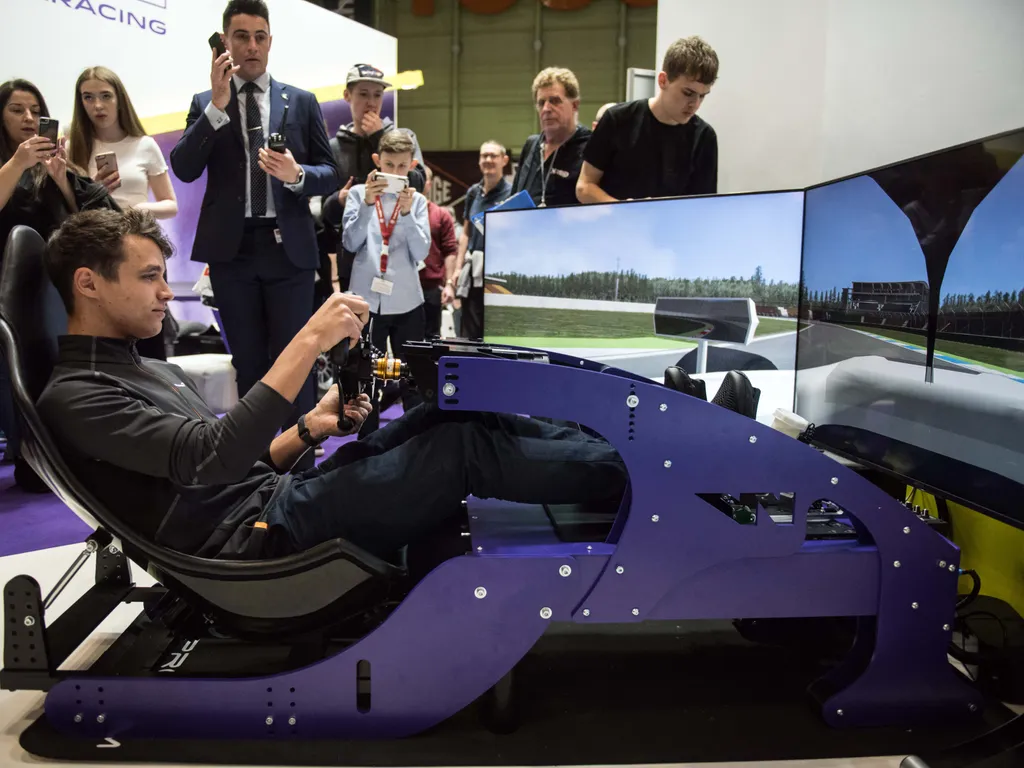 Lando Norris, LandoNorris, McLaren Formula 1 driver Lando Norris of Great Britain drives on a motor racing simulator at the Autosport International show held in the NEC convention centre in Birmingham, central England on January 12, 2019. (Photo by Oli SC