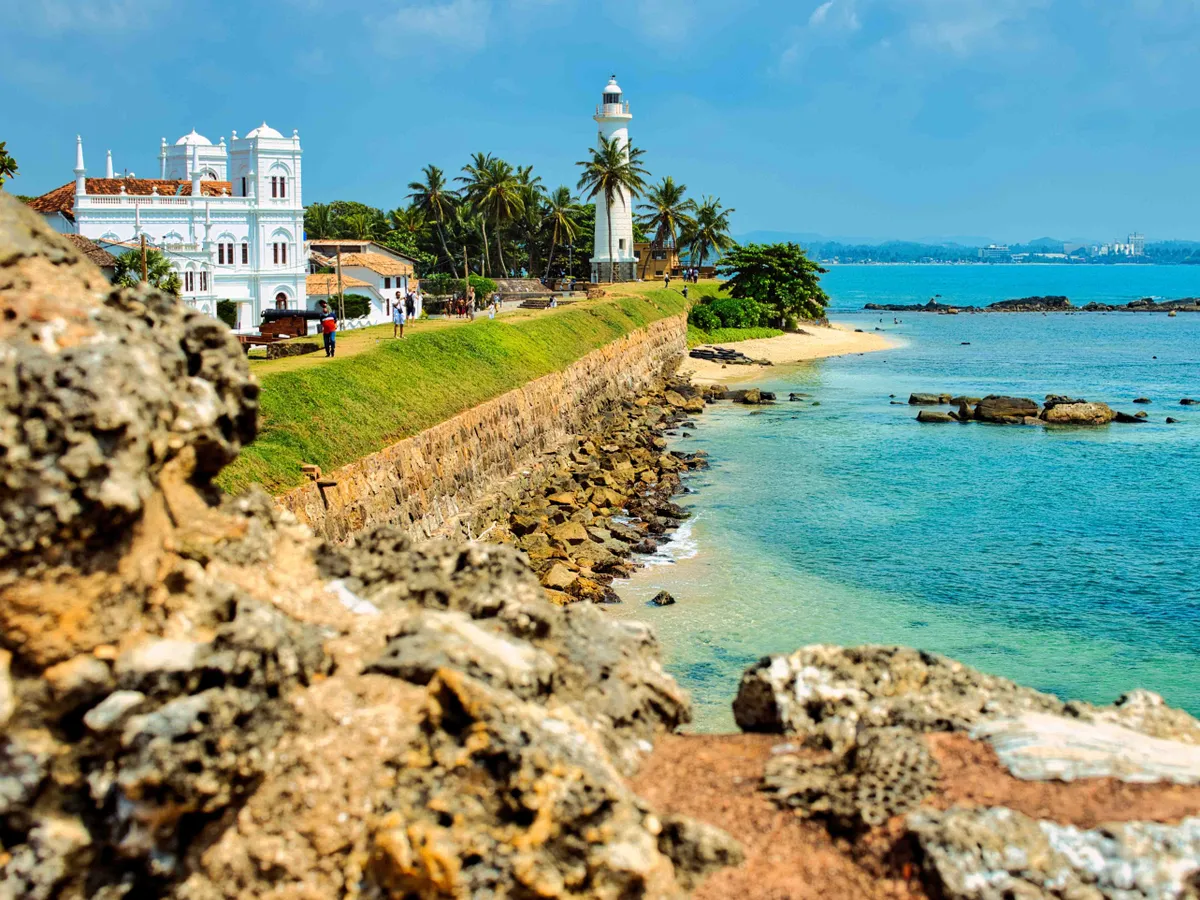 Sunny day, harbour and lighthouse in Galle, Sri Lanka . January 29 2021. This was during the Covid 19 pandemic. Such rich beautiful colours on a hot day.
