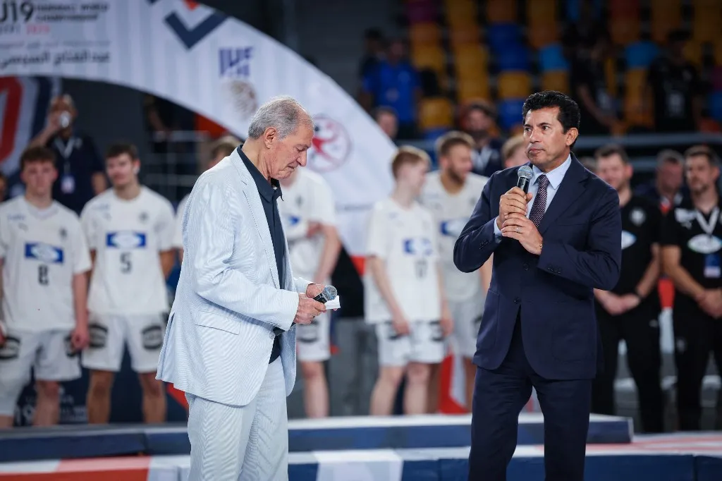 The president of International Handball federation Hassan Moustafa with Ashraf Sobhy Minister of Youth and Sports of Egypt during the final ceremony of the IHF World Championship, Egypt 2025 (Photo by Mohamed Tageldin / Middle East Images via AFP)