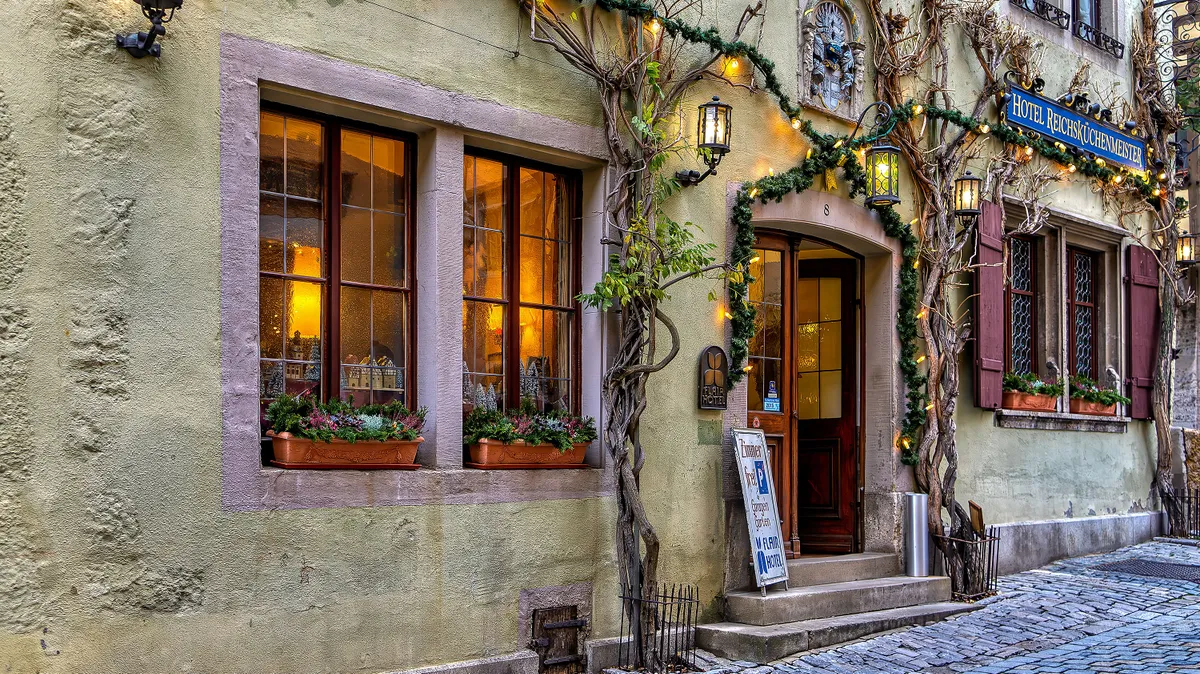 Rothenburg ob der Tauber, Germany- December 2, 2015: The New Year in the medieval town of Rothenburg ob der Tauber, guests enjoy festive decorations and a welcoming ambiance at the local hotel.