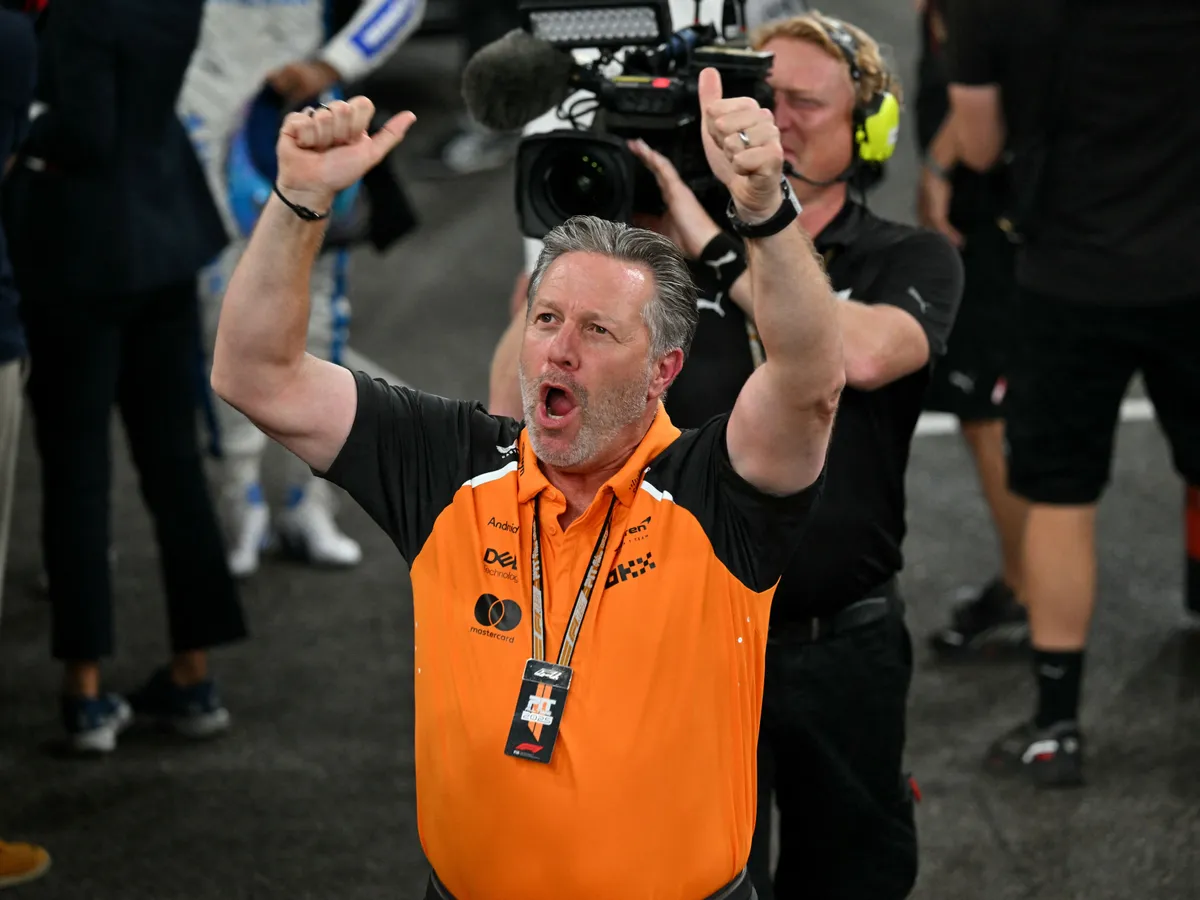 McLaren's CEO Zak Brown reacts after his team's British driver Lando Norris finished the race third to win the world championship title at the end of the Abu Dhabi Formula One Grand Prix at the Yas Marina Circuit in Abu Dhabi on December 7, 2025. (Photo by Andrej ISAKOVIC / POOL / AFP)