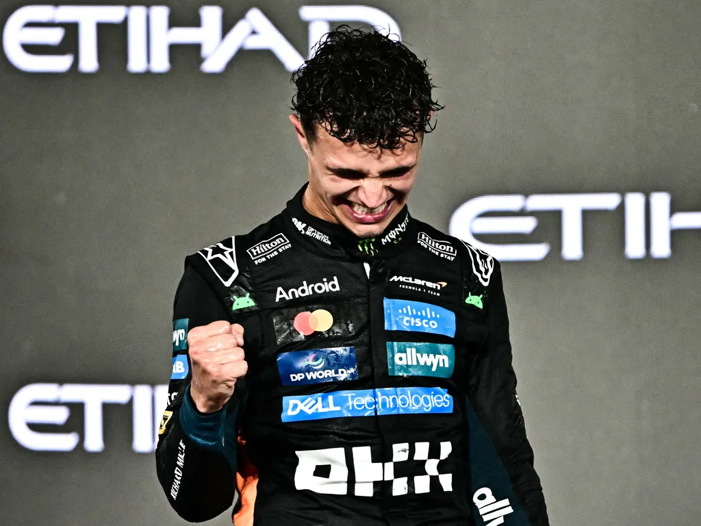 Lando Norris, LandoNorris,
World champion and race third-placed McLaren's British driver Lando Norris celebrates on the podium at the end of the Abu Dhabi Formula One Grand Prix at the Yas Marina Circuit in Abu Dhabi on December 7, 2025. (Photo by Giusepp