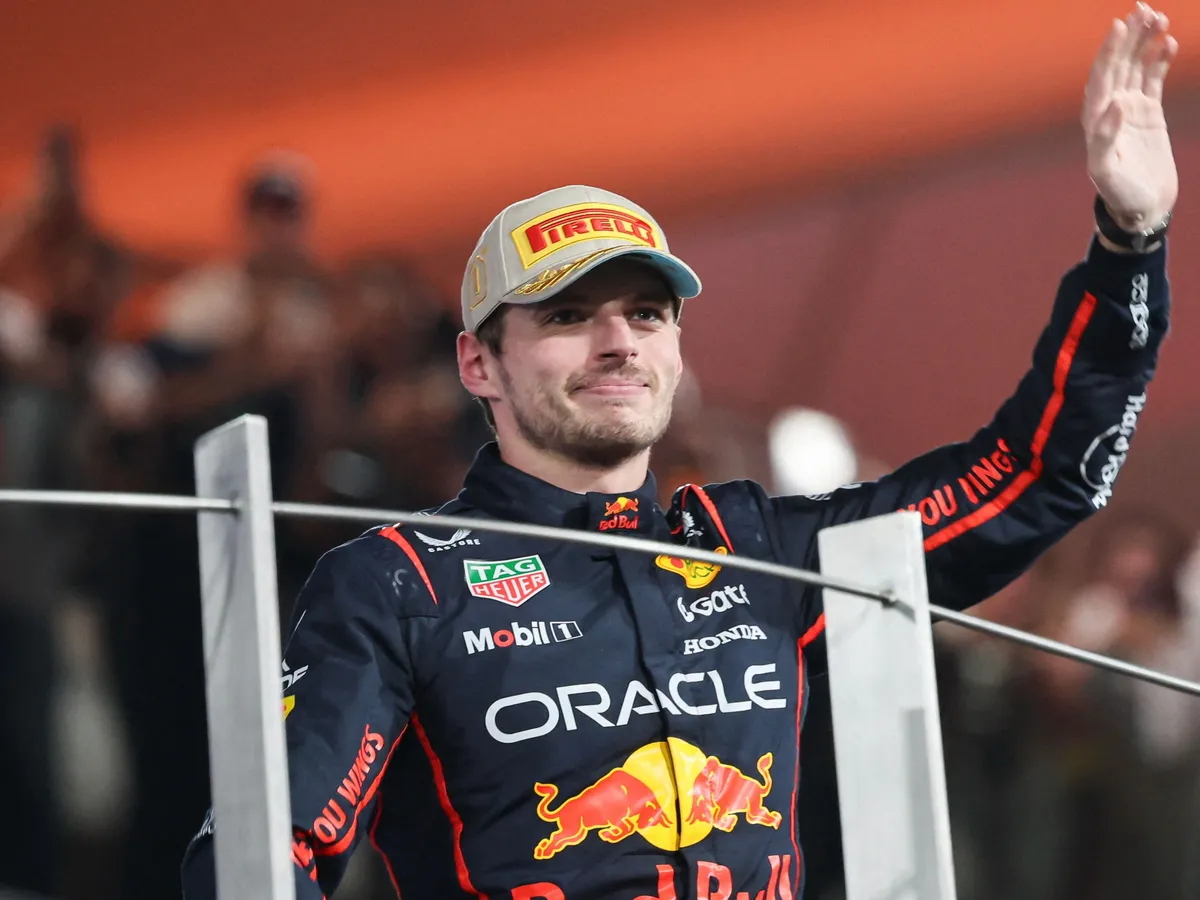 Winner of the race Max Verstappen of the Netherlands on the podium celebrating his win. Verstappen drives the F1 race car No 1, the RB21 with Honda RBPT power unit for the Oracle Red Bull Racing Formula One Team. Max Verstappen is celebrating the win of the Abu Dhabi 2025 race and second place on the 2025 driver's championship. 2025 Formula 1 Etihad Airways Abu Dhabi Grand Prix at Yas Marina Circuit, United Arab Emirates on December 7, 2025.  (Photo by Nicolas Economou/NurPhoto) (Photo by Nicolas Economou / NurPhoto via AFP)