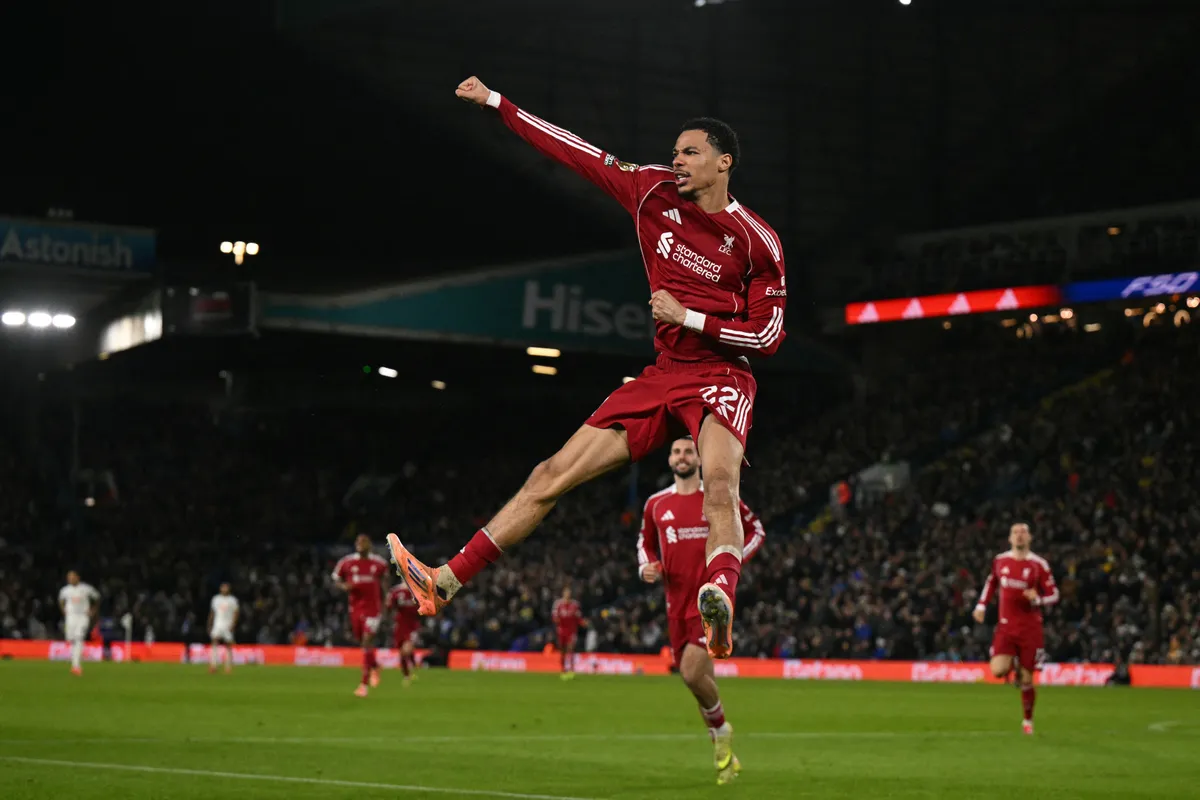 Liverpool's French striker #22 Hugo Ekitike celebrates after scoring the opening goal of the English Premier League football match between Leeds United and Liverpool at Elland Road in Leeds, northern England on December 6, 2025. (Photo by Oli SCARFF / AFP) / RESTRICTED TO EDITORIAL USE. No use with unauthorized audio, video, data, fixture lists, club/league logos or 'live' services. Online in-match use limited to 120 images. An additional 40 images may be used in extra time. No video emulation. Social media in-match use limited to 120 images. An additional 40 images may be used in extra time. No use in betting publications, games or single club/league/player publications. / 