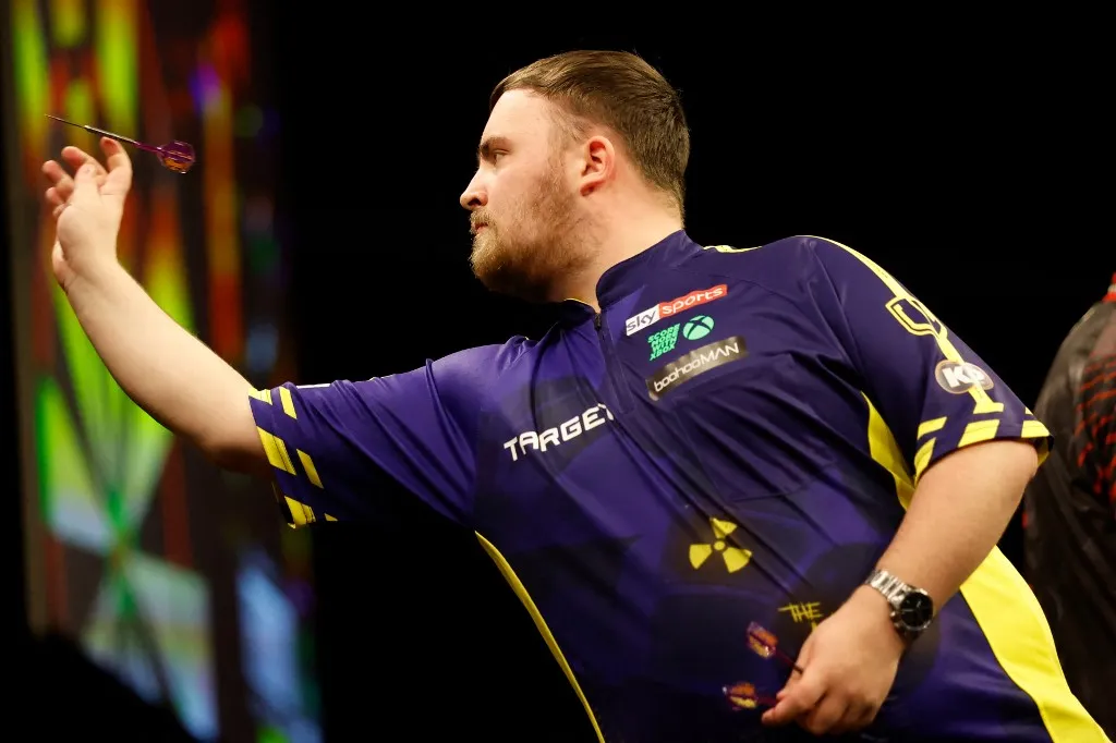 English' Luke Littler competes against English' Stephen Bunting during the eleventh round of Premier League Darts play at Ahoy Rotterdam, in Rotterdam, on April 17, 2025. (Photo by Bas Czerwinski / ANP / AFP) / Netherlands OUT