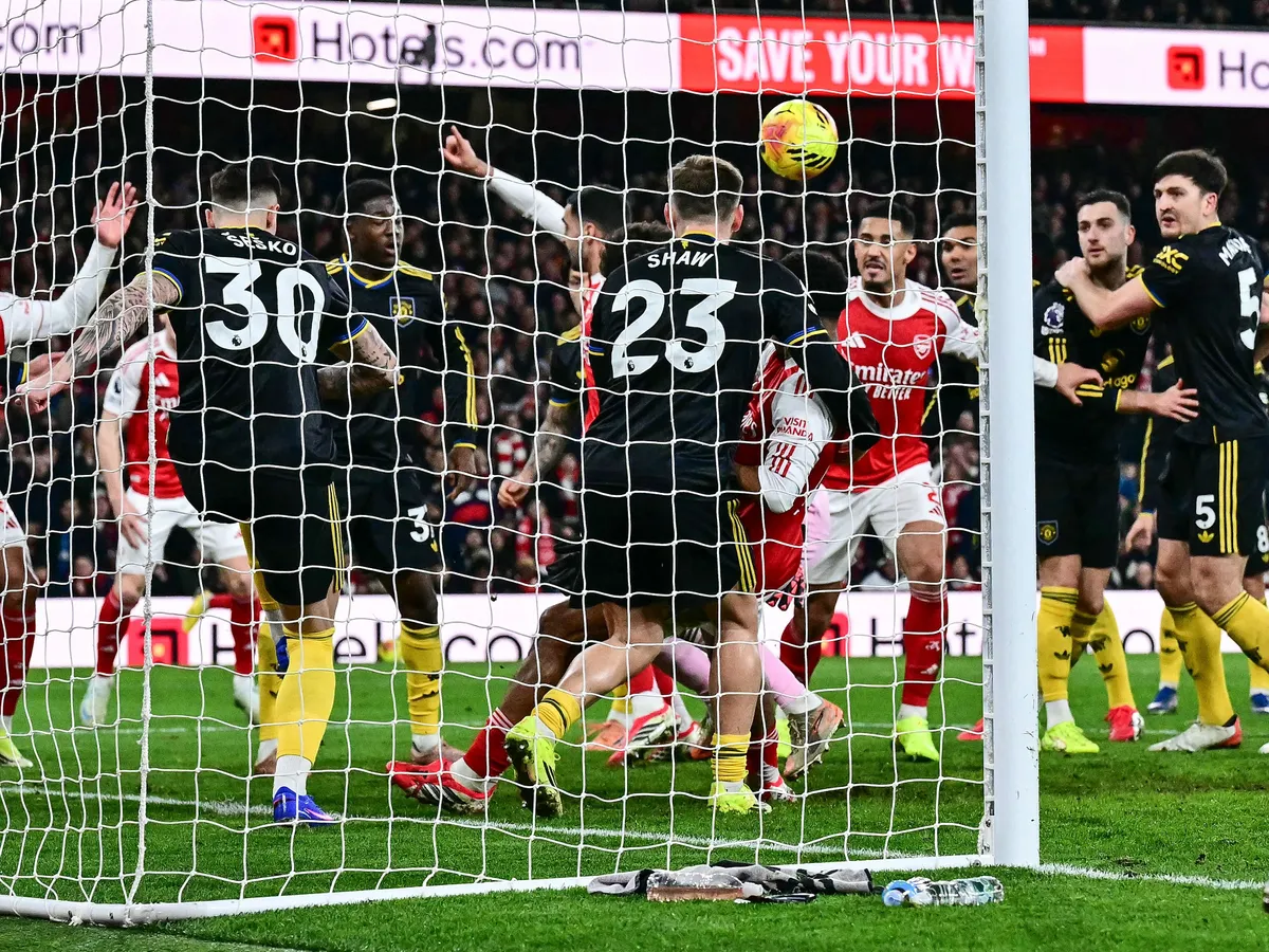 Players tussle in front of the goal as Arsenal's Spanish midfielder #23 Mikel Merino scores a late equaliser during the English Premier League football match between Arsenal and Manchester United at the Emirates Stadium in London on January 25, 2026. (Photo by Ben STANSALL / AFP) / RESTRICTED TO EDITORIAL USE. No use with unauthorized audio, video, data, fixture lists, club/league logos or 'live' services. Online in-match use limited to 120 images. An additional 40 images may be used in extra time. No video emulation. Social media in-match use limited to 120 images. An additional 40 images may be used in extra time. No use in betting publications, games or single club/league/player publications. / 