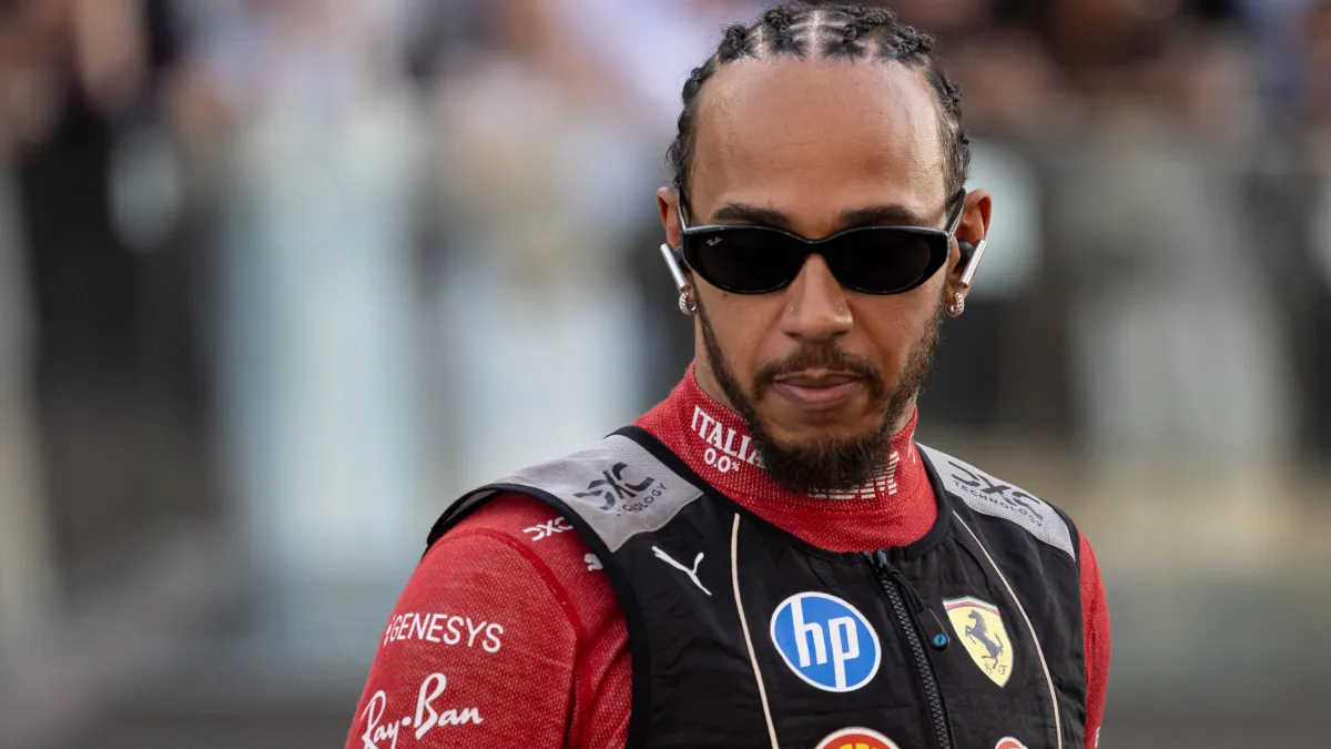 Lewis Hamilton of United Kingdom spotted heading to the driver's parade ahead of the race. Sir Lewis Carl Davidson Hamilton is driving the F1 race car No 44, the Ferrari SF-25 for the Scuderia Ferrari Formula One Team,. Abu Dhabi Grand Prix 2025 at Yas Marina Circuit, United Arab Emirates on December 7, 2025. (Photo by Nicolas Economou/NurPhoto) (Photo by Nicolas Economou / NurPhoto via AFP)