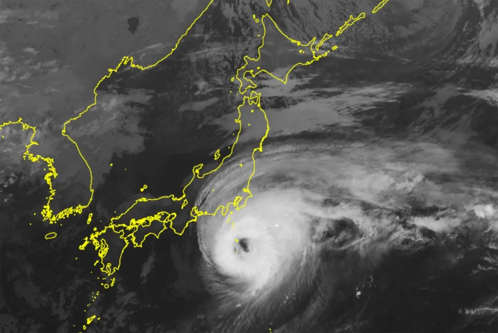 This handout from the Japan Meteorological Agency (JMA) released on October 9, 2025 shows a Himawari satellite image of Typhoon Halong (bottom) moving closer to the Izu island chain south of Tokyo. (Photo by Handout / Japan Meteorological Agency / AFP) / RESTRICTED TO EDITORIAL USE - MANDATORY CREDIT "AFP PHOTO / JAPAN METEOROLOGICAL AGENCY" - HANDOUT - NO MARKETING NO ADVERTISING CAMPAIGNS - DISTRIBUTED AS A SERVICE TO CLIENTS