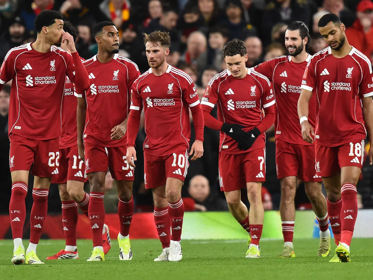 Liverpool's German midfielder #07 Florian Wirtz (3R) celebrates scoring the team's third goal during the English FA Cup third round football match between Liverpool and Barnsley at Anfield in Liverpool, north west England on January 12, 2026. (Photo by PETER POWELL / AFP) / RESTRICTED TO EDITORIAL USE. No use with unauthorized audio, video, data, fixture lists, club/league logos or 'live' services. Online in-match use limited to 120 images. An additional 40 images may be used in extra time. No video emulation. Social media in-match use limited to 120 images. An additional 40 images may be used in extra time. No use in betting publications, games or single club/league/player publications. / 
