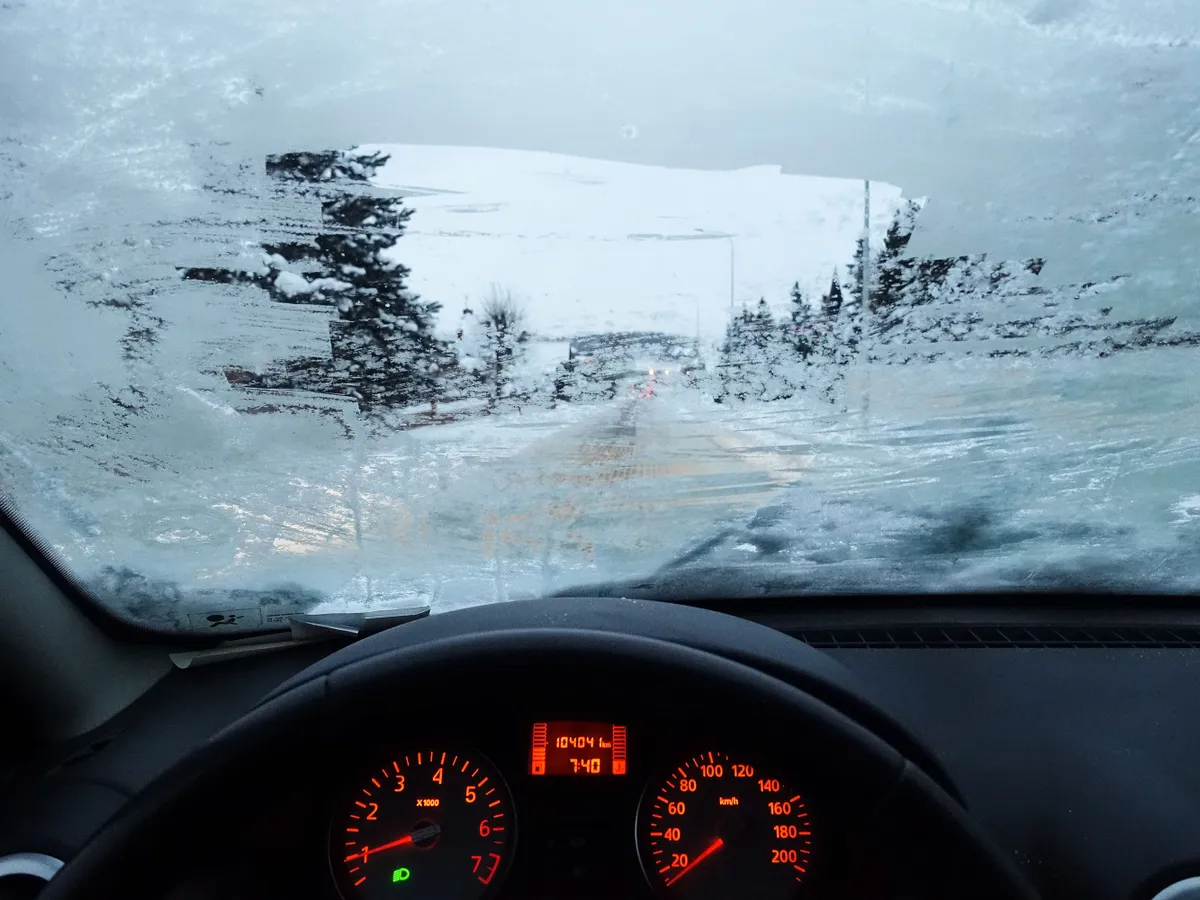 A man driving Dacia Sandero car during the high frost wit completely frozen windscreen is seen in Gdynia, Poland on 18 January 2021  (Photo by Michal Fludra/NurPhoto via Getty Images)