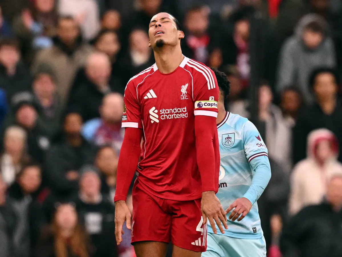 Liverpool's Dutch defender #04 Virgil van Dijk reacts during the English Premier League football match between Liverpool and Burnley at Anfield in Liverpool, north west England on January 17, 2026. (Photo by Oli SCARFF / AFP) / RESTRICTED TO EDITORIAL USE. No use with unauthorized audio, video, data, fixture lists, club/league logos or 'live' services. Online in-match use limited to 120 images. An additional 40 images may be used in extra time. No video emulation. Social media in-match use limited to 120 images. An additional 40 images may be used in extra time. No use in betting publications, games or single club/league/player publications. / 