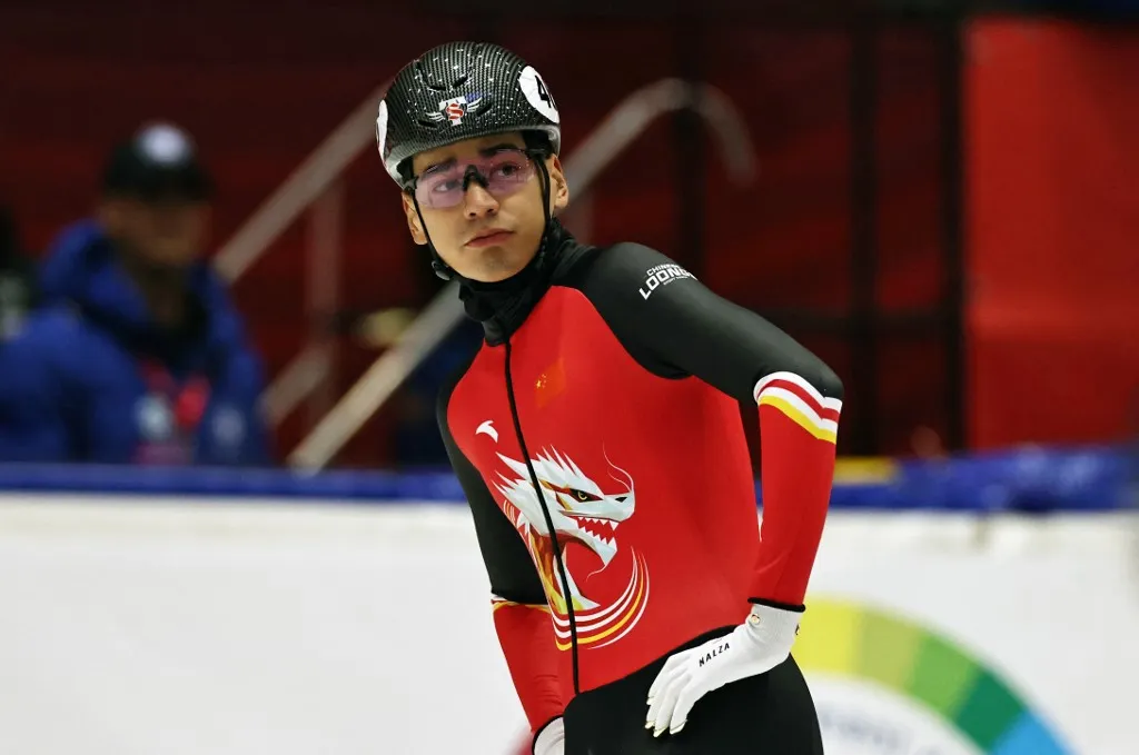 (251121) -- GDANSK, Nov. 21, 2025 (Xinhua) -- Liu Shaolin of team China reacts before the mixed team relay quarterfinals at the ISU Short Track World Tour #3 speed skating event in Gdansk, Poland, Nov. 20, 2025. (Xinhua/Gao Jing) (Photo by Gao Jing / Xinhua via AFP)