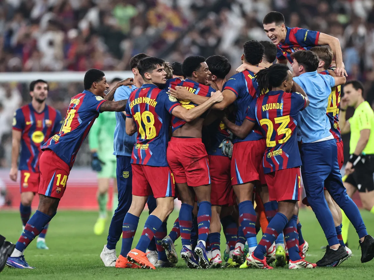 Barcelona's players celebrate after winning the Spanish Super Cup final football match between FC Barcelona and Real Madrid at the King Abdullah Stadium in Jeddah on January 11, 2026. (Photo by Fadel SENNA / AFP)