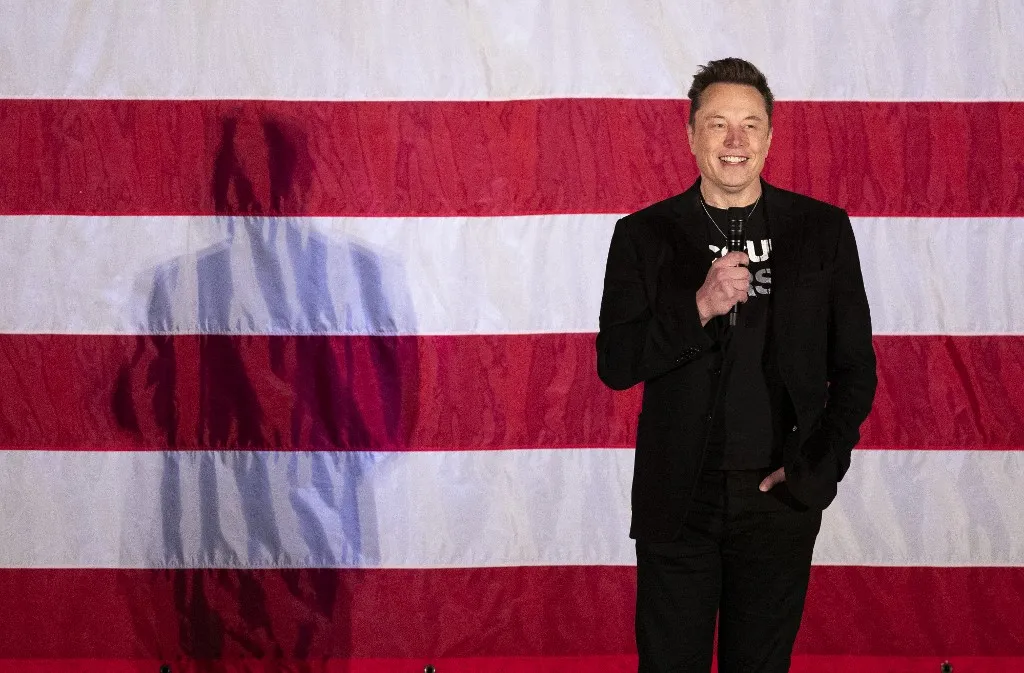 (FILES) Tesla and SpaceX CEO Elon Musk speaks during a town hall event hosted by America PAC in support of former US President and Republican presidential candidate Donald Trump at the Greater Philadelphia Expo Center in Oaks, Pennsylvania, on October 18, 2024. Elon Musk's platform X on January 14, 2026 announced measures to prevent its AI chatbot Grok from undressing images of real people, following global backlash over its generation of sexualized images of women and children. (Photo by RYAN COLLERD / AFP)