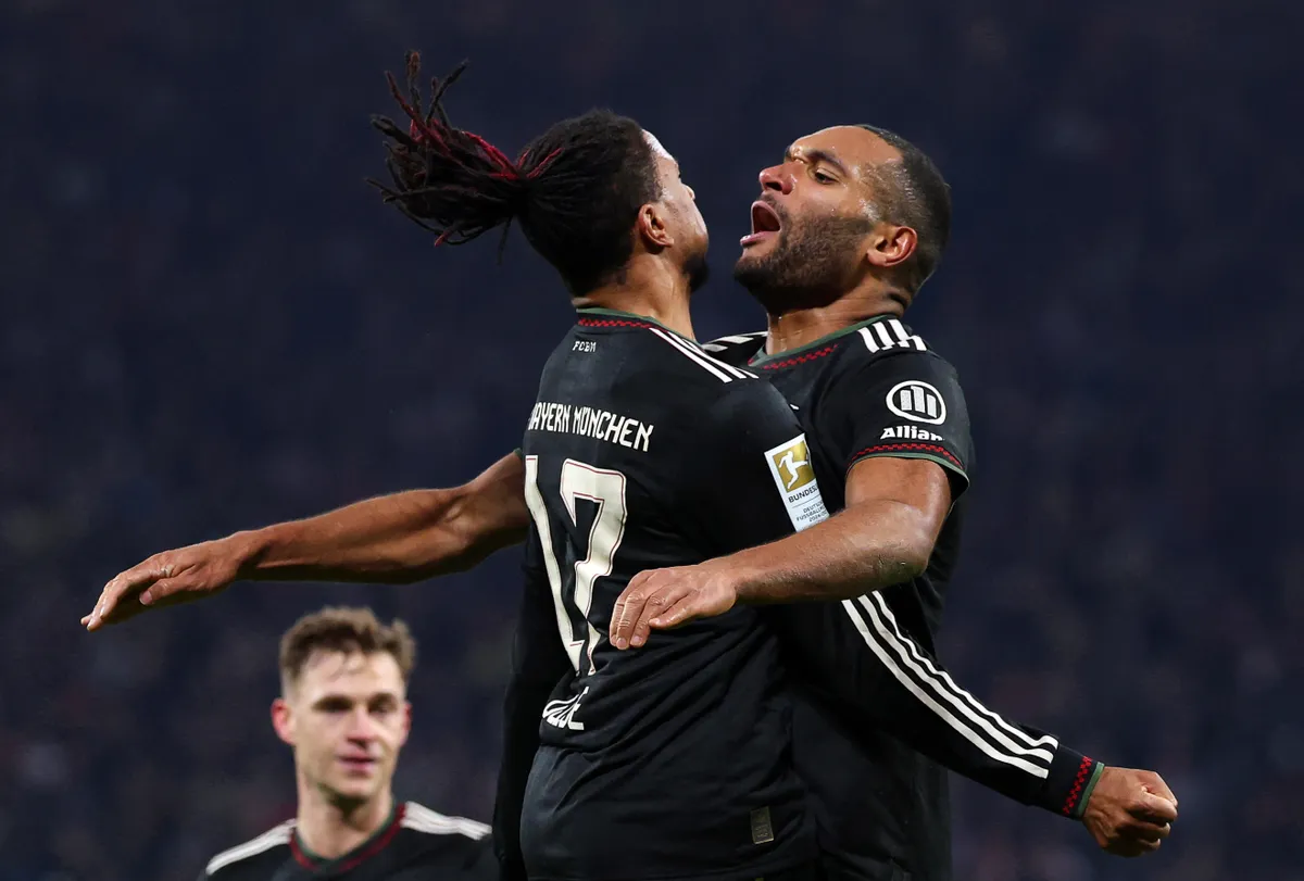17 January 2026, Saxony, Leipzig: Soccer: Bundesliga, RB Leipzig - Bayern Munich, Matchday 18, Red Bull Arena, Jonathan Tah (r, Bayern Munich) celebrates his goal with teammate Michael Olise (Bayern Munich) to make it 1:3. IMPORTANT NOTE: In accordance with the regulations of the DFL German Football League and the DFB German Football Association, it is prohibited to use or have used photographs taken in the stadium and/or of the match in the form of sequential images and/or video-like photo series. Photo: Jan Woitas/dpa (Photo by JAN WOITAS / dpa Picture-Alliance via AFP)
