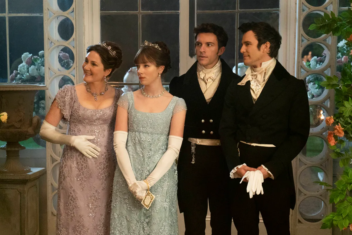 Bridgerton Netflix (L to R) Ruth Gemmell as Lady Violet Bridgerton, Claudia Jessie as Eloise Bridgerton, Jonathan Bailey as Anthony Bridgerton, and Luke Thomspon as Benedict Bridgerton