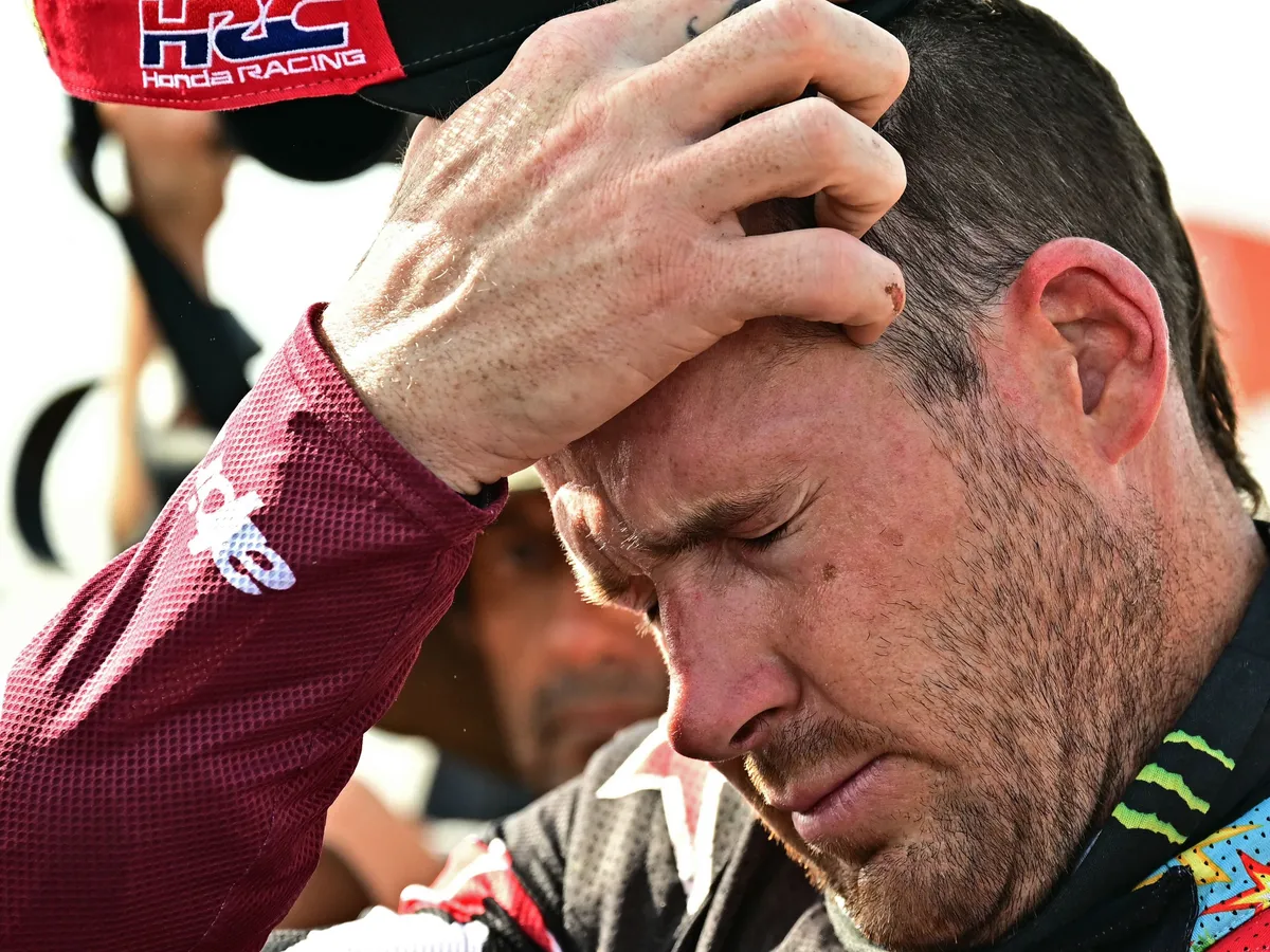 Second placed US rider Ricky Brabec with a Honda Crf 450 reacts at the end of the 48th edition of the Dakar Rally 2026 in Yanbu, Saudi Arabia, on January 17, 2026. (Photo by Giuseppe CACACE / AFP)
