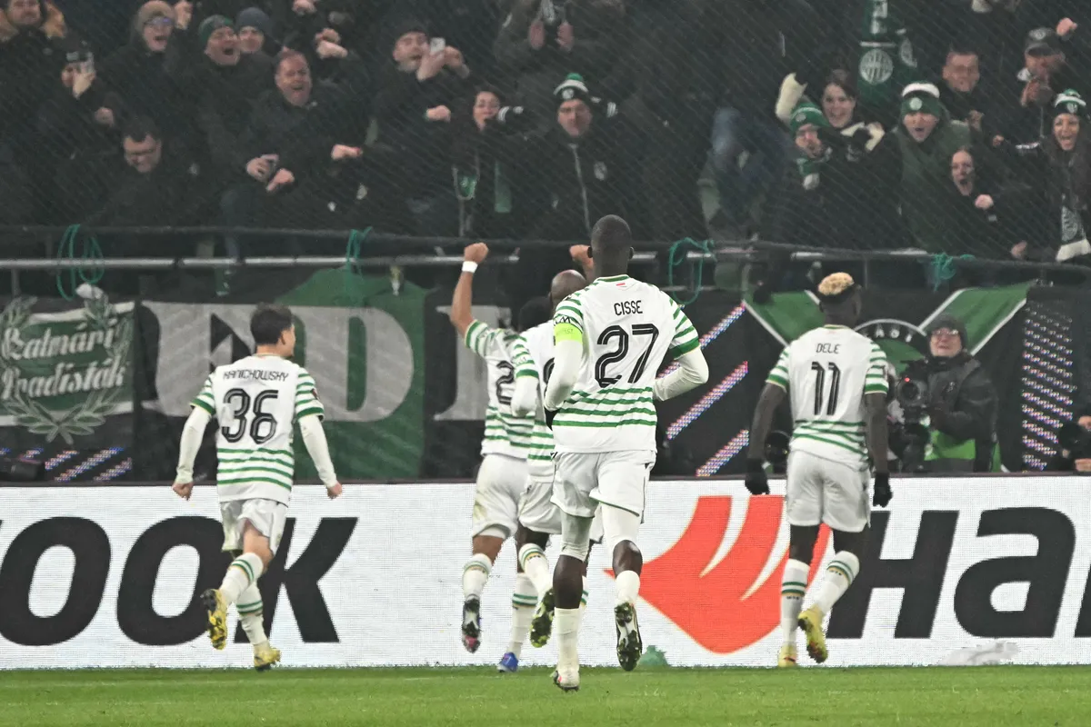 Ferencvaros' Nigerian forward #11 Bamidele Yusuf (R) celebrates scoring his team's first goal during the UEFA Europa League football match 1st round- Day 7 between Ferencvarosi TC and Panathinaikos in Budapest, Hungary on January 22, 2026. (Photo by Attila KISBENEDEK / AFP)