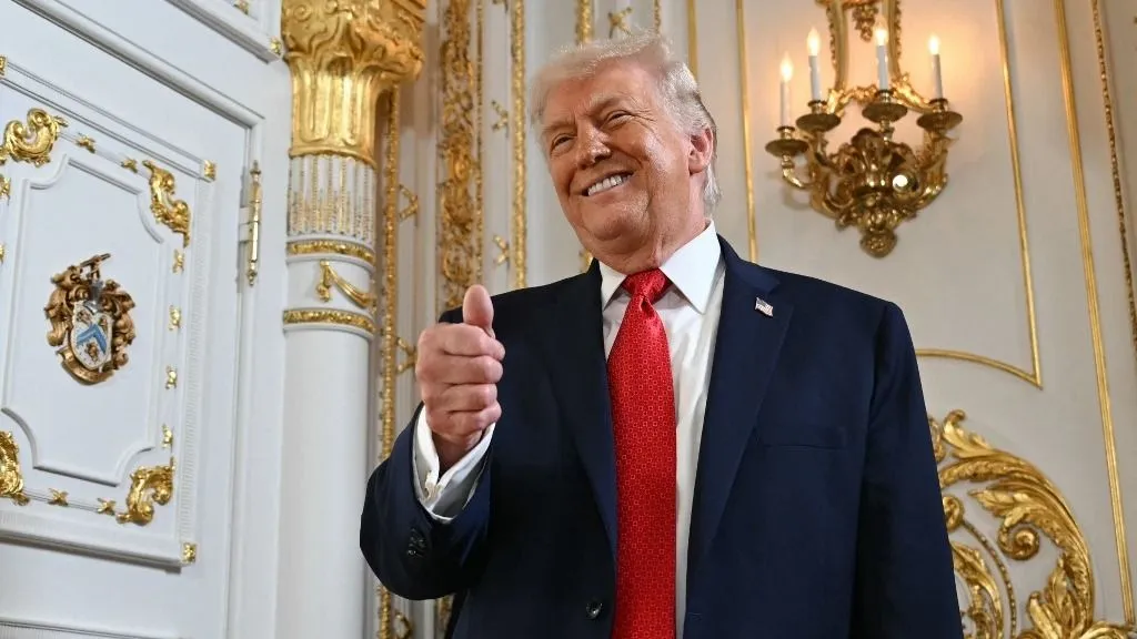 US President Donald Trump gives a thumbs up as he arrives at a dedication ceremony for Southern Boulevard, in the ballroom at Mar-a-Lago in Palm Beach, Florida, on January 16, 2026. (Photo by ANDREW CABALLERO-REYNOLDS / AFP)