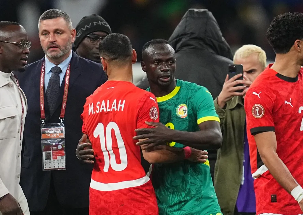 Sadio Mane of Senegal and Mohamed Salah Mahrous Ghaly of Egypt gestures during the Semi-final final match between Senegal and Egypt at Tangier Stadium, Tangier, Morocco on January 14, 2026. (Photo by Ulrik Pedersen/NurPhoto) (Photo by Ulrik Pedersen / NurPhoto via AFP)