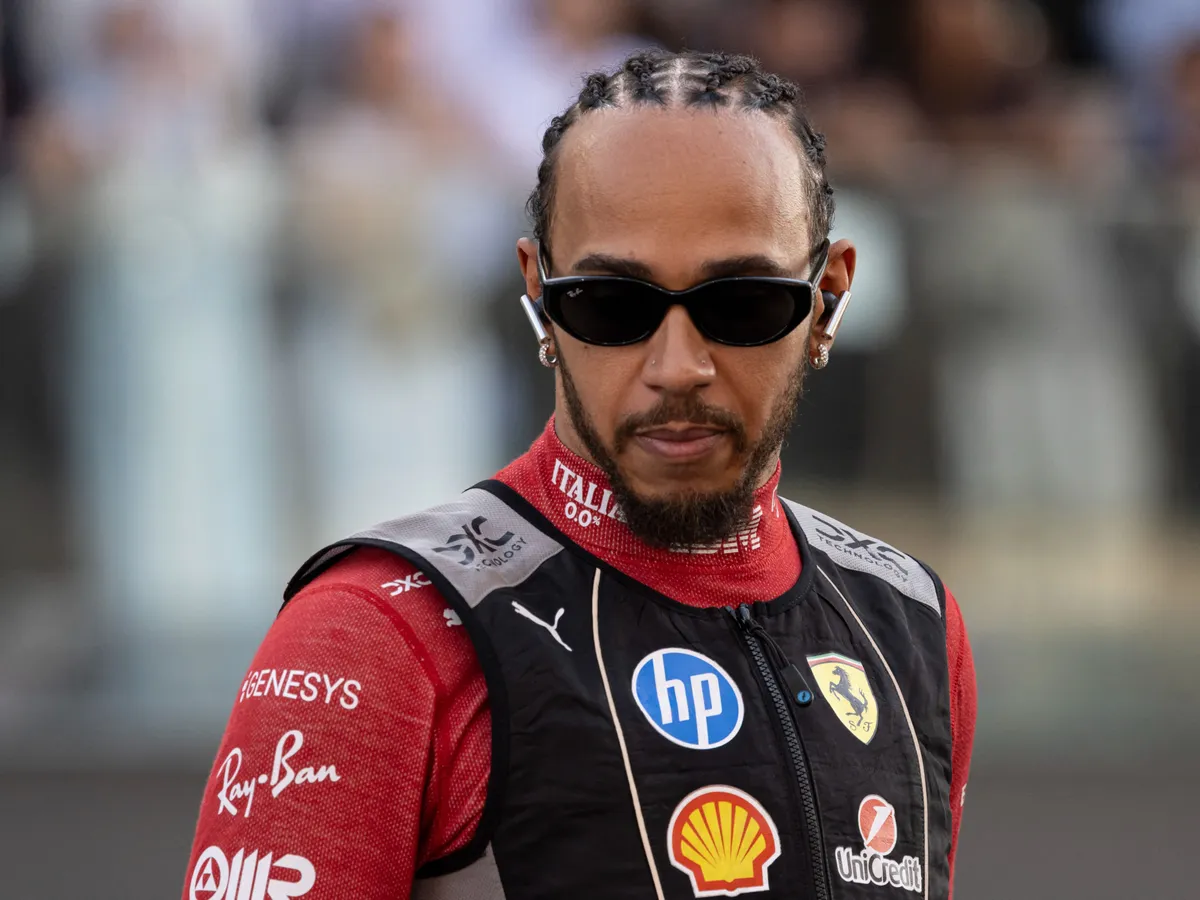 Lewis Hamilton of United Kingdom spotted heading to the driver's parade ahead of the race. Sir Lewis Carl Davidson Hamilton is driving the F1 race car No 44, the Ferrari SF-25 for the Scuderia Ferrari Formula One Team,. Abu Dhabi Grand Prix 2025 at Yas Marina Circuit, United Arab Emirates on December 7, 2025.  (Photo by Nicolas Economou/NurPhoto) (Photo by Nicolas Economou / NurPhoto via AFP)
