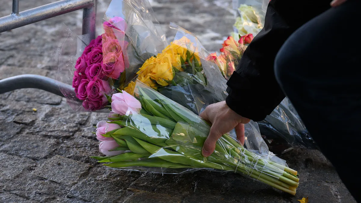 CRANS-MONTANA, SWITZERLAND - JANUARY 01: Flowers are laid on the street after a fire broke out overnight at Le Constellation bar on January 01, 2026 in Crans-Montana, Switzerland. According to authorities, the fire began around 1:30 AM local time. (Photo by Harold Cunningham/Getty Images)