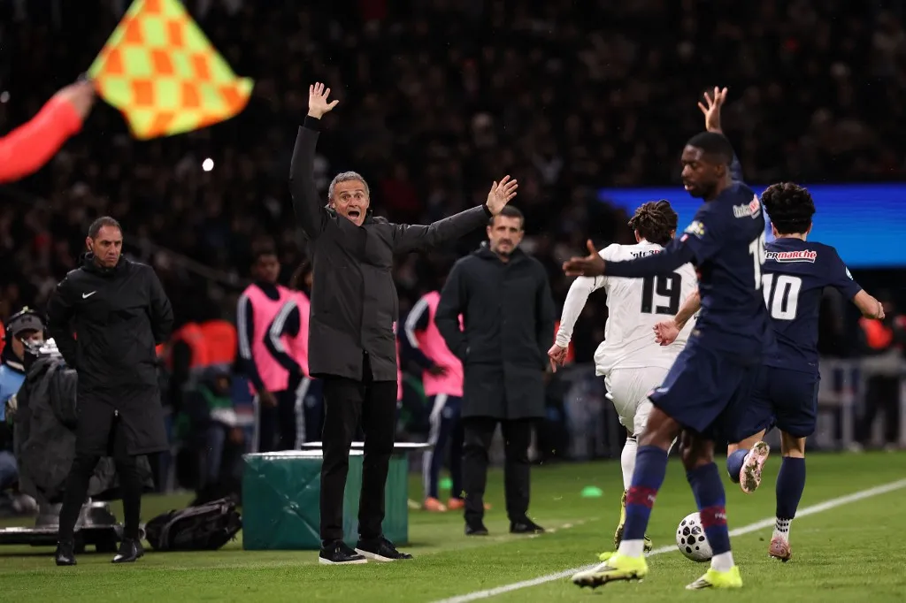 Paris Saint-Germain's Spanish head coach Luis Enrique gives instructions to his players during the French Cup round of 32 football match between Paris Saint-Germain (PSG) and Paris FC at the Parc des Princes stadium in Paris on January 12, 2026. (Photo by Anne-Christine POUJOULAT / AFP)