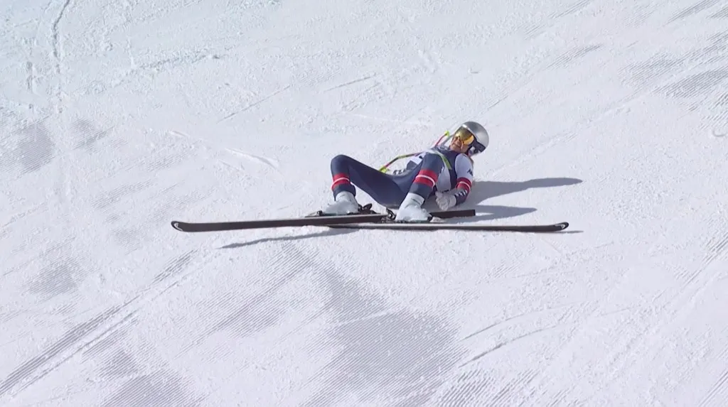 This handout video grab from IOC/OBS shows US Lindsey Vonn crashing during the women's downhill event at the Milano Cortina 2026 Winter Olympic Games in Cortina dAmpezzo on February 8, 2026. (Photo by Handout / various sources / AFP) / RESTRICTED TO EDITORIAL USE - MANDATORY CREDIT "AFP PHOTO / IOC-OBS " - HANDOUT - NO MARKETING NO ADVERTISING CAMPAIGNS - DISTRIBUTED AS A SERVICE TO CLIENTS